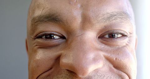 Close-Up of Smiling Man's Face Expressing Joy