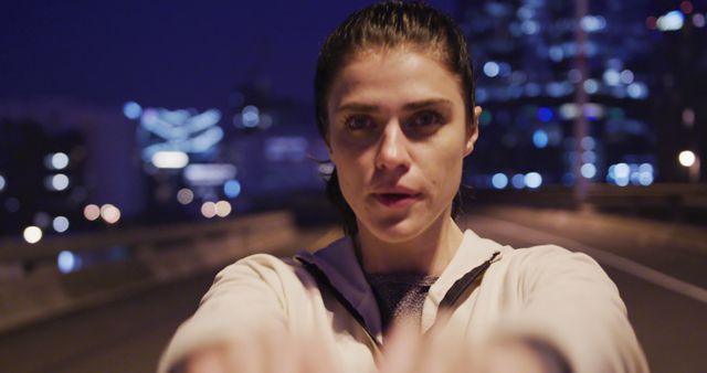 Focused Woman Jogging at Night on Empty City Street - Download Free Stock Images Pikwizard.com