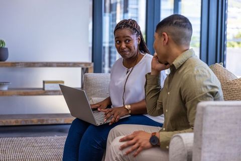 Colleagues communicating in modern office setting
