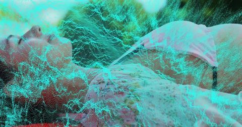 Reclining women in pale tank tops and underwear on bed with turquoise digital mesh overlay