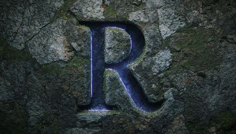 Rustic stone letter r with mystical blue glow