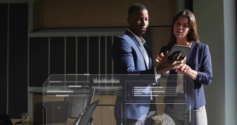 Business professionals using tablet with augmented reality dashboard for data insights