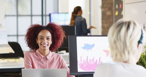 Diverse Women Collaborating in Modern Open-Plan Office