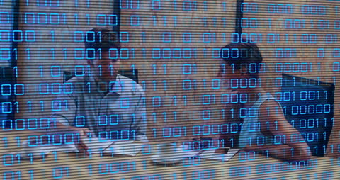 Business Team Meeting with Digital Binary Overlay