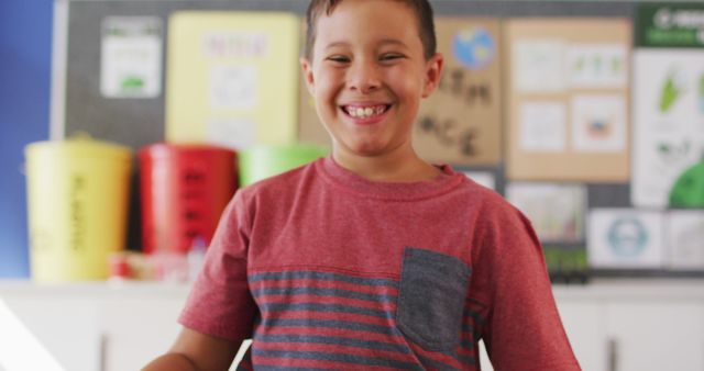 Smiling Young Boy in Classroom with Recycling Bins - Download Free Stock Images Pikwizard.com