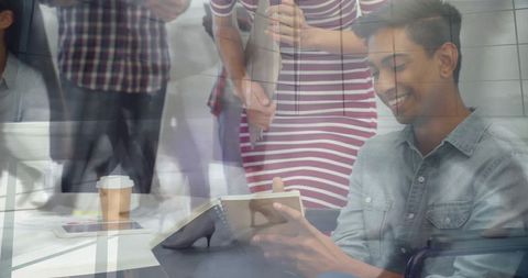 Young Professional Reviewing Notes in Modern Office Space