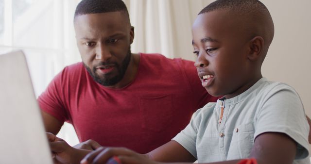 Father Assisting Son with Online Learning Activity - Download Free Stock Images Pikwizard.com