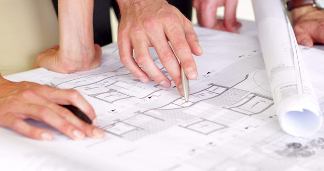 Close-up of Architects Collaborating Over Blueprints and Floor Plans - Download Free Stock Images Pikwizard.com