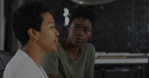 Professional Office Conversation between Focused Coworkers