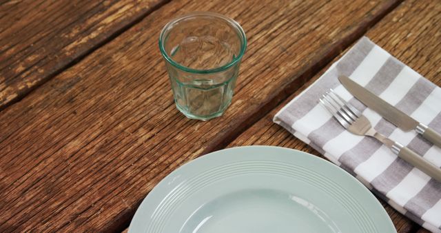 Empty Plate with Cutlery and Glass on Wooden Table - Download Free Stock Images Pikwizard.com