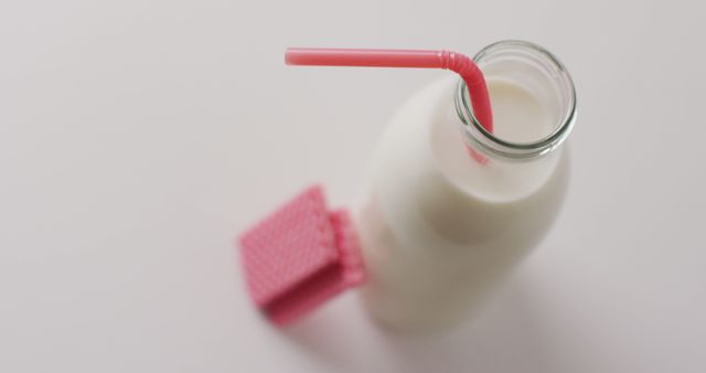 Glass Bottle of Milk with Pink Cookies - Download Free Stock Images Pikwizard.com