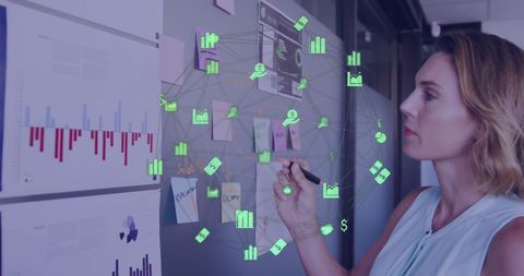 Focused Businesswoman Analyzing Data with Tech Icons Overlay - Download Free Stock Images Pikwizard.com
