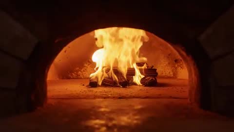 Logs Igniting in Rustic Brick Oven