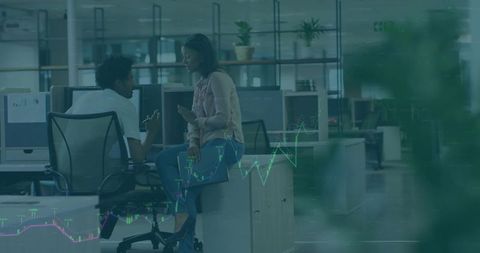 Business professionals discussing collaboration strategies in modern office