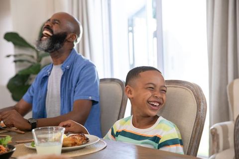Father and Son Sharing Joyful Moments at Home