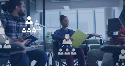 Diverse Team Collaborating on Social Media Strategies in Modern Office