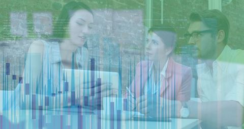 Colleagues Analyzing Data Over Tablet in Modern Office Environment