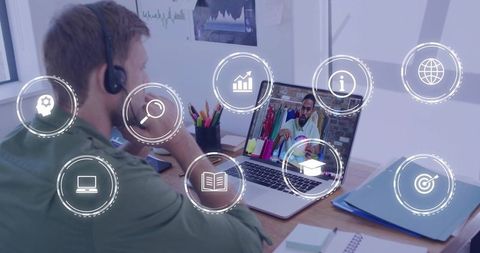 Remote collaboration man wearing headset joining virtual meeting on laptop with overlay icons