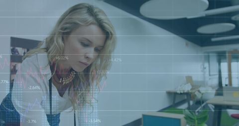 Businesswoman Focusing on Analytics in Modern Office - Download Free Stock Images Pikwizard.com