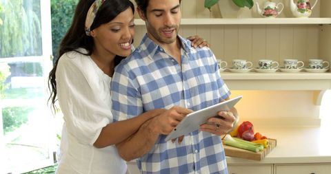 Couple Navigating Recipe on Tablet in Cozy Kitchen - Download Free Stock Images Pikwizard.com