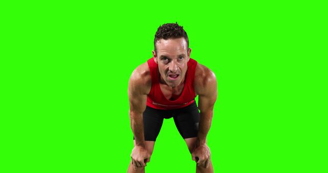 Exhausted Athlete in Red Singlet Resting Against Green Screen - Download Free Stock Images Pikwizard.com