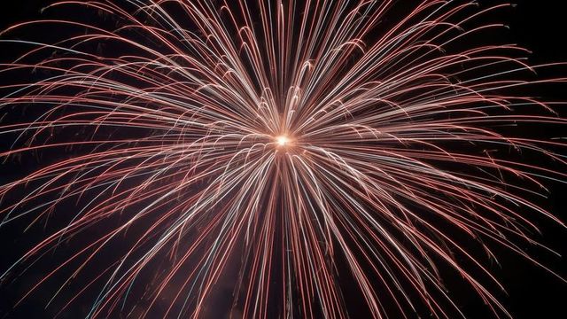 Stunning fireworks display with radiant colorful trails at night