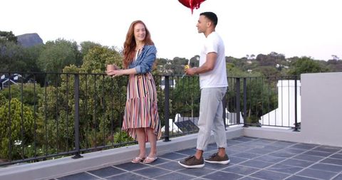 Romantic Rooftop Proposal with Heart Balloons