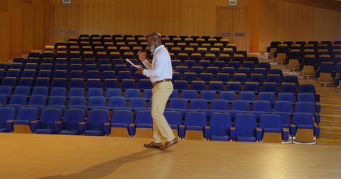 Businessman Practicing Speech on Auditorium Stage - Download Free Stock Images Pikwizard.com