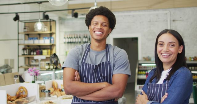 Image of happy diverse female and male waiters at coffee shop. coffee and bistro shop, running small independent business.