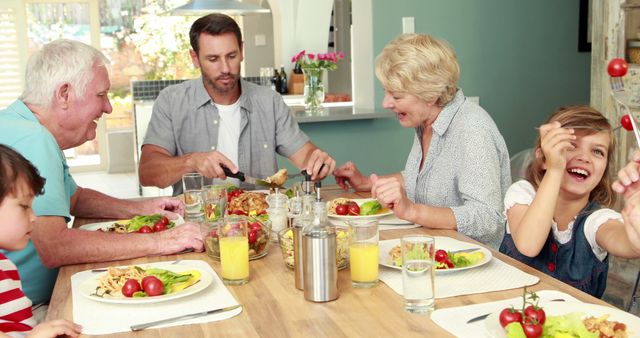 Family Enjoying Meal Together Sharing Happy Moment - Download Free Stock Images Pikwizard.com