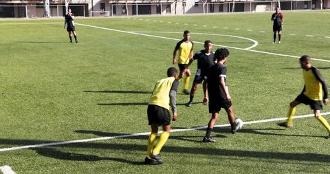 Youth Soccer Players Competing on Field in Intense Game