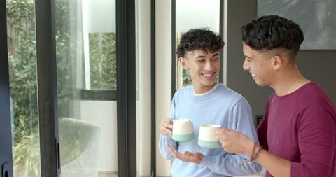 Happy Male Friends Enjoying Coffee at Home