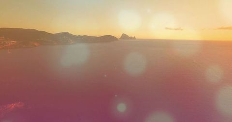 Golden Sunset Over Tranquil Coastal Water