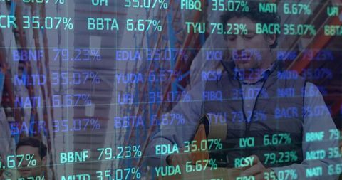 Warehouse workers with digital stock market overlay