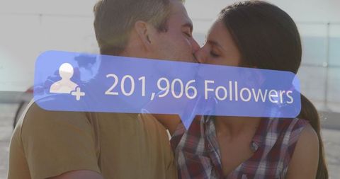 Social media popular couple kissing on beach