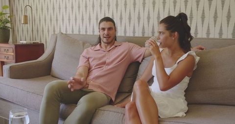Couple Relaxing at Home Enjoying Refreshing Drinks Together