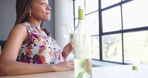Relaxing Woman Enjoying White Wine by Sunny Window - Download Free Stock Images Pikwizard.com