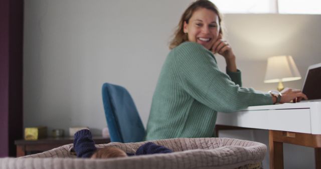 Smiling Mother Working from Home with Baby in Room - Download Free Stock Images Pikwizard.com