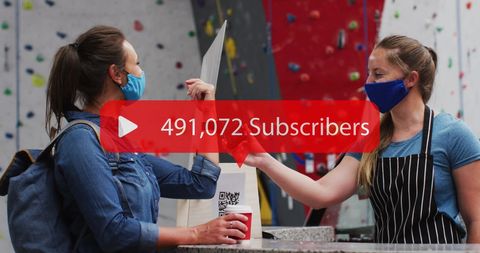 Women in Face Masks Chatting at Rock Climbing Gym