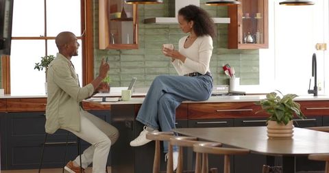 Couple Bonding Over Coffee in Modern Kitchen Environment