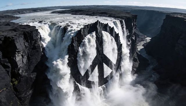 Cascading waterfall carving deep canyon with dramatic peace symbol on rock spire, misty gorge