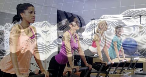 Women Exercising on Reformers in Fitness Studio with Digital Overlay