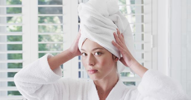 Woman in Bathrobe with Towel Turban in Bright Bathroom - Download Free Stock Images Pikwizard.com