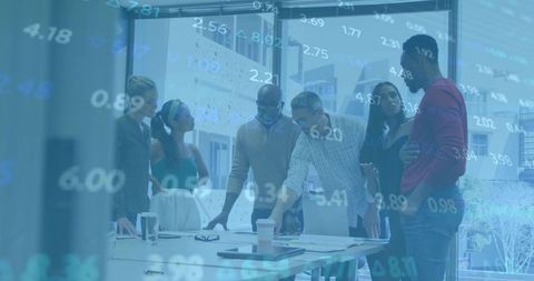 Business Team Analyzing Market Data Together in Office Setting