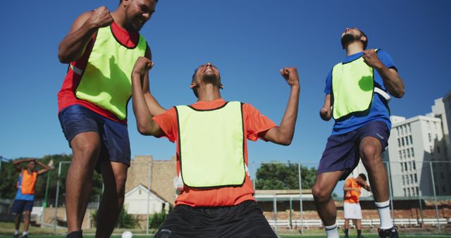 Ecstatic Young Men Celebrating Outdoor Soccer Win on Sunny Day - Download Free Stock Images Pikwizard.com