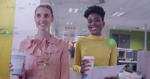 Diverse Businesswomen Analyzing Financial Data in Modern Office