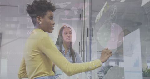 Diverse colleagues analyzing financial data on holographic screen