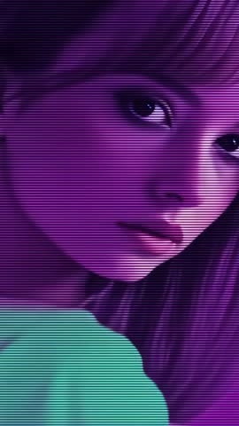 Vertical video showing model turning to camera for close crop with purple scanline lighting
