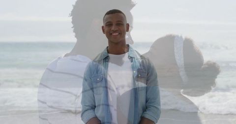Smiling man at beachfront with embracing silhouette