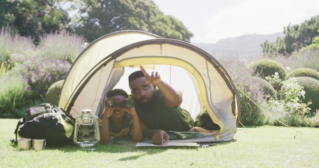 Father and Son Exploring Nature from Tent with Binoculars - Download Free Stock Images Pikwizard.com